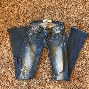 Hollister distressed low-rise boot cut jeans